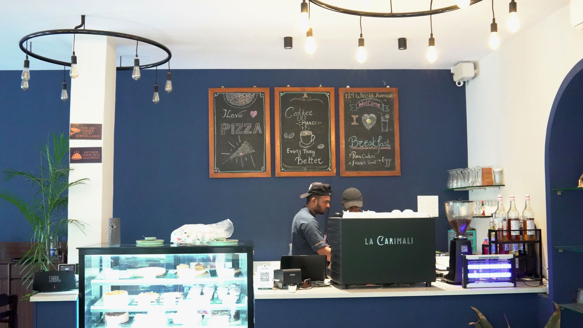 The coffee counter and chalkboards at 129 Whiskk. Avenue, Mahesh Nagar