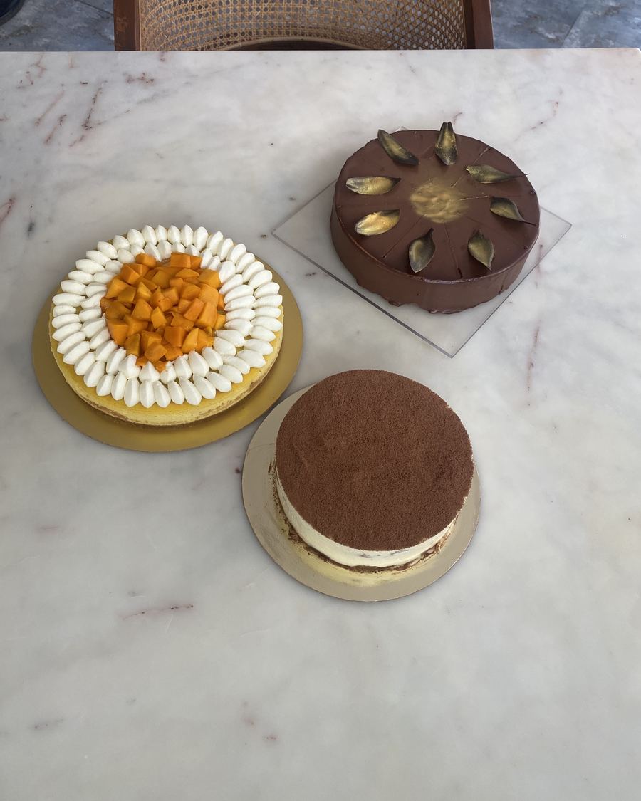 Mango cheesecake, tiramisu and a chocolate cake