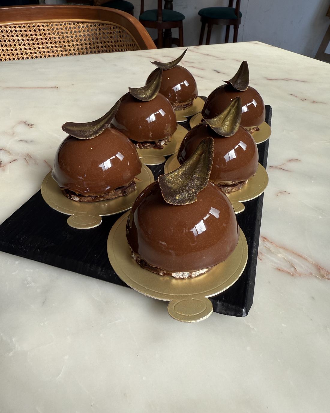 Chocolate entremets on the marble counter at 129 Whiskk. Avenue